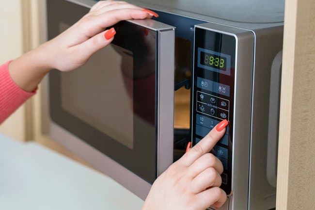 An electric oven with touch panel and electronic display.